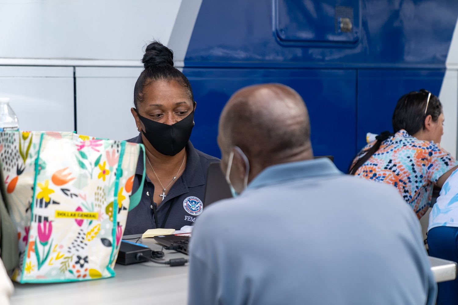 FEMA personnel helps survivor register for assistance.